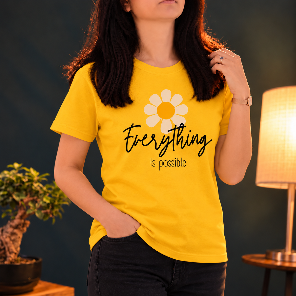 Yellow short-sleeve T-shirt with a pale daisy and Everything Is Possible lettering